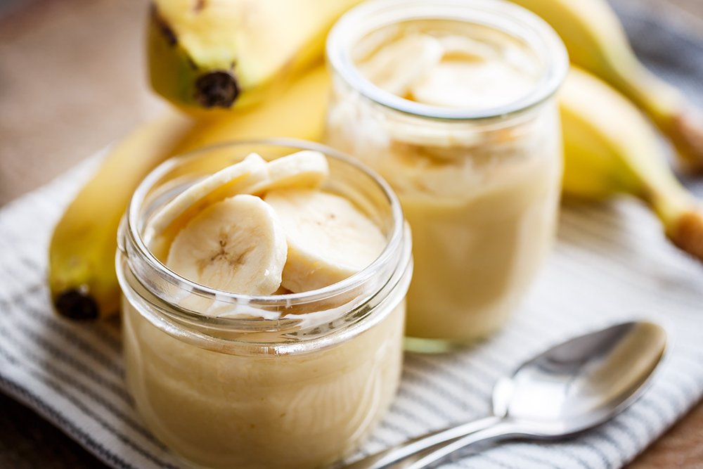 A dessert made of bananas in a glas for the winter