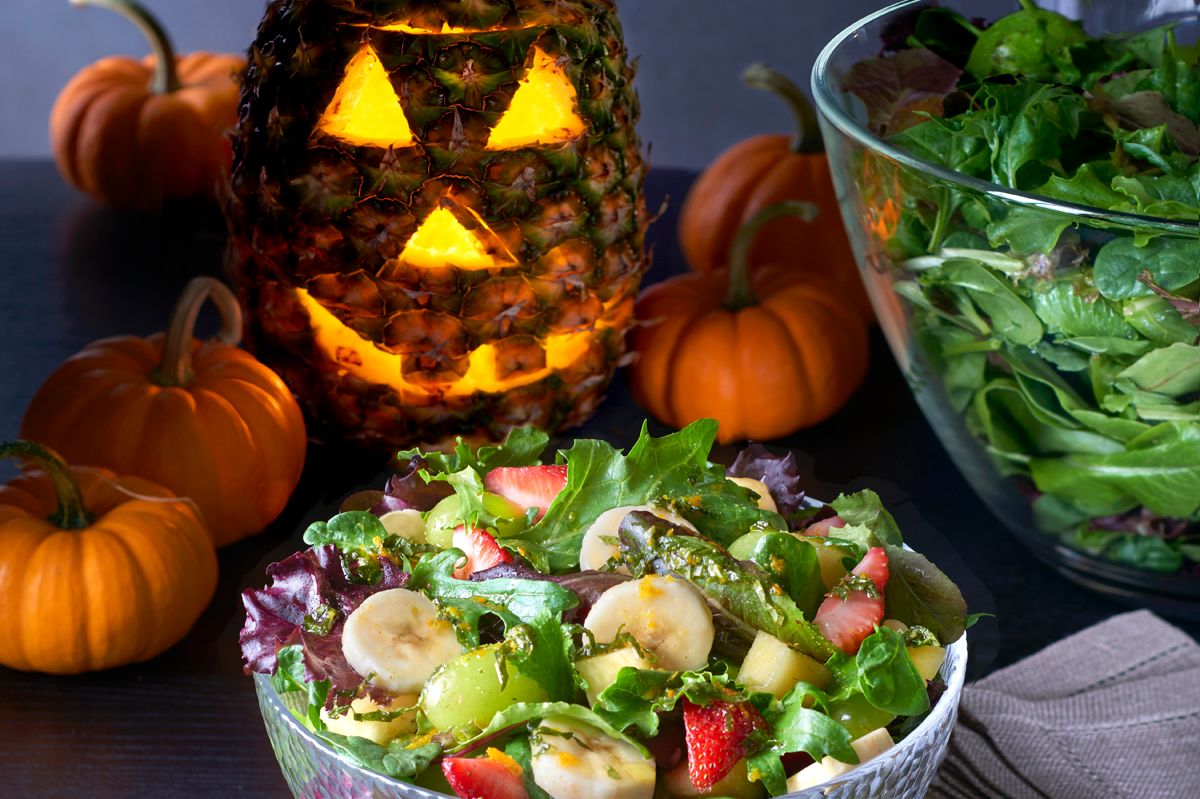 Pineapple Jack-O’-Lantern and Bountiful Fruit Salad with Orange-Mint Dressing